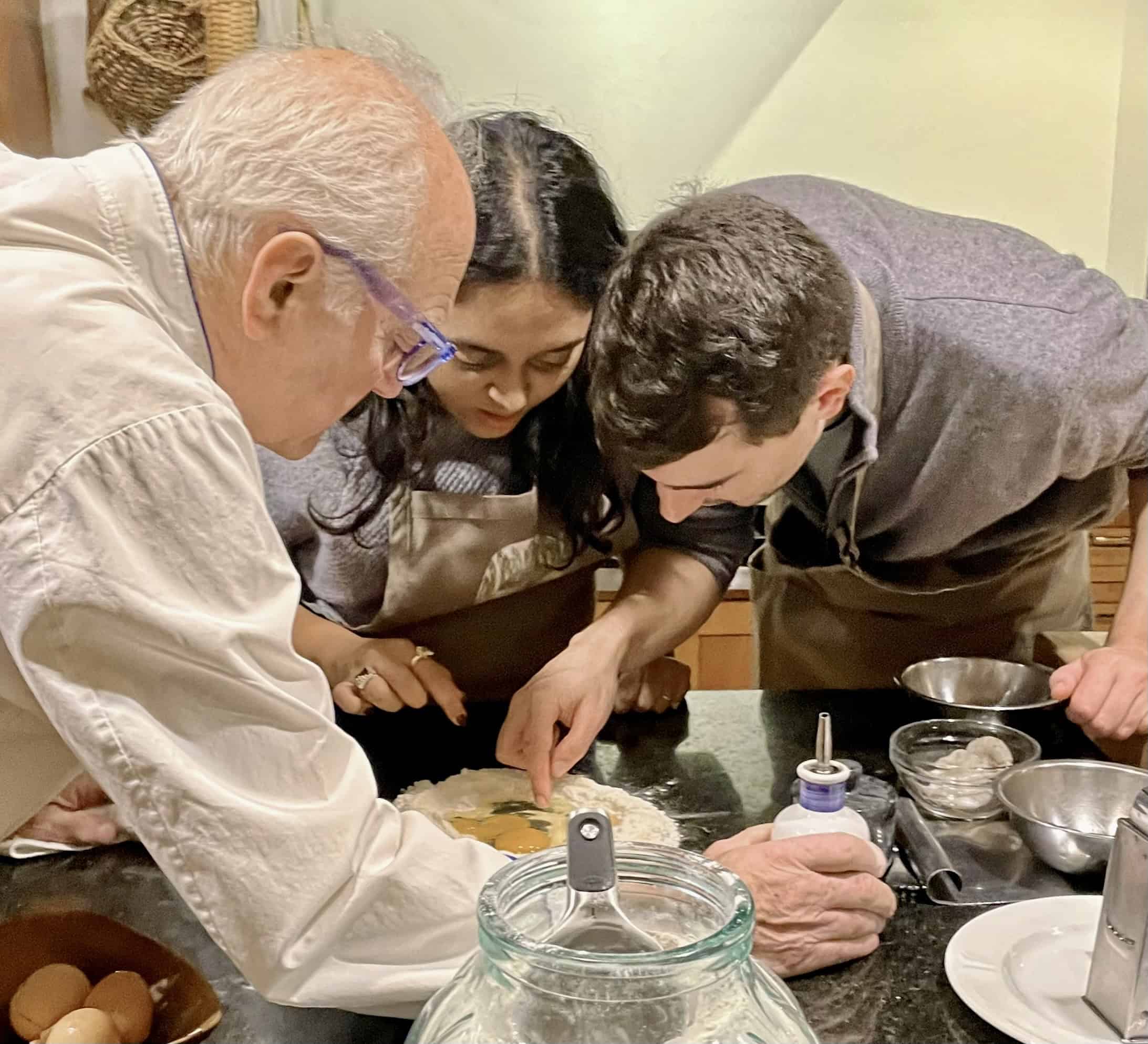 Cooking class with diverse participants at Odyssey Events.