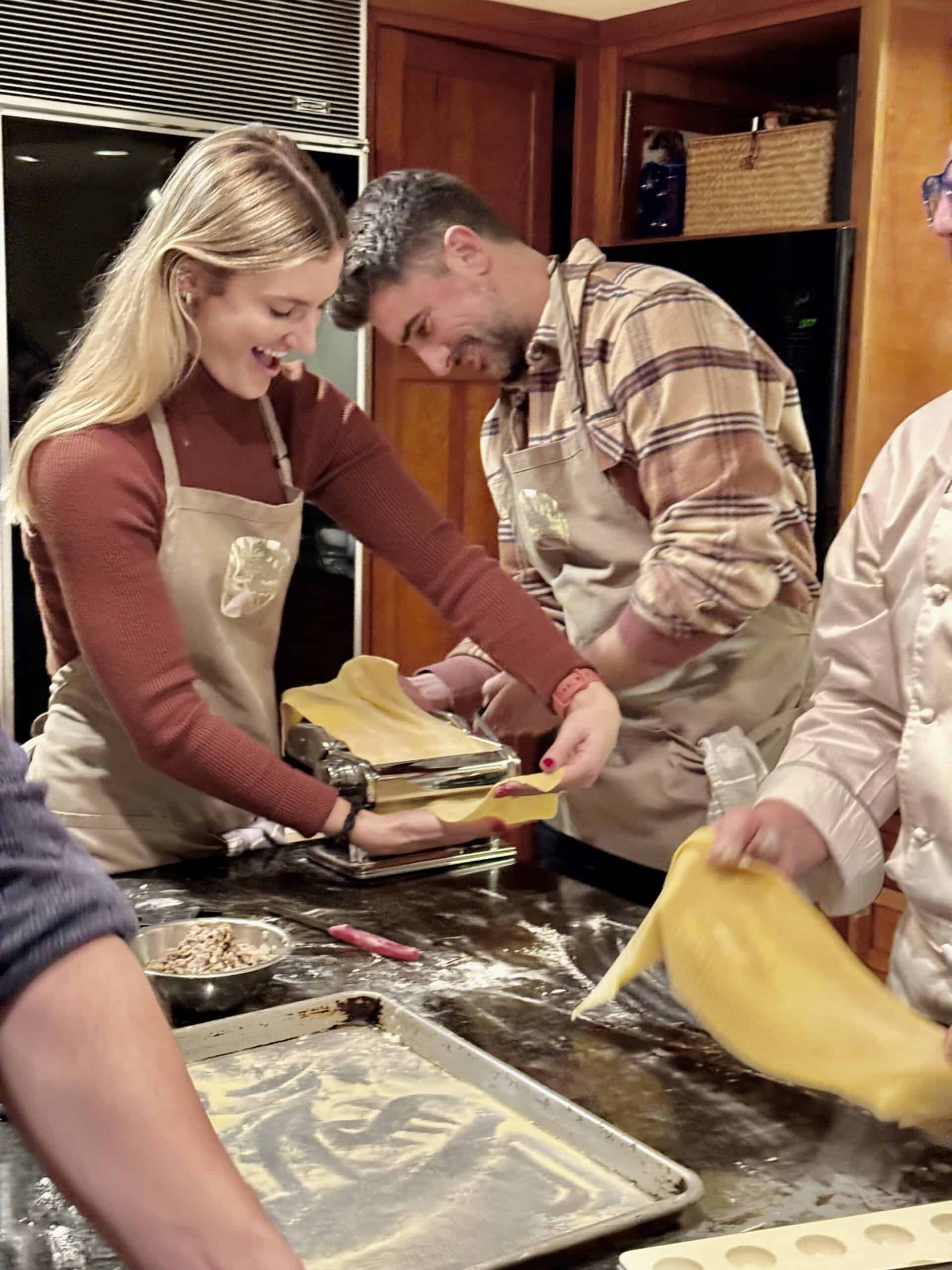 Group of people enjoying a cooking class at Odyssey Events kitchen.