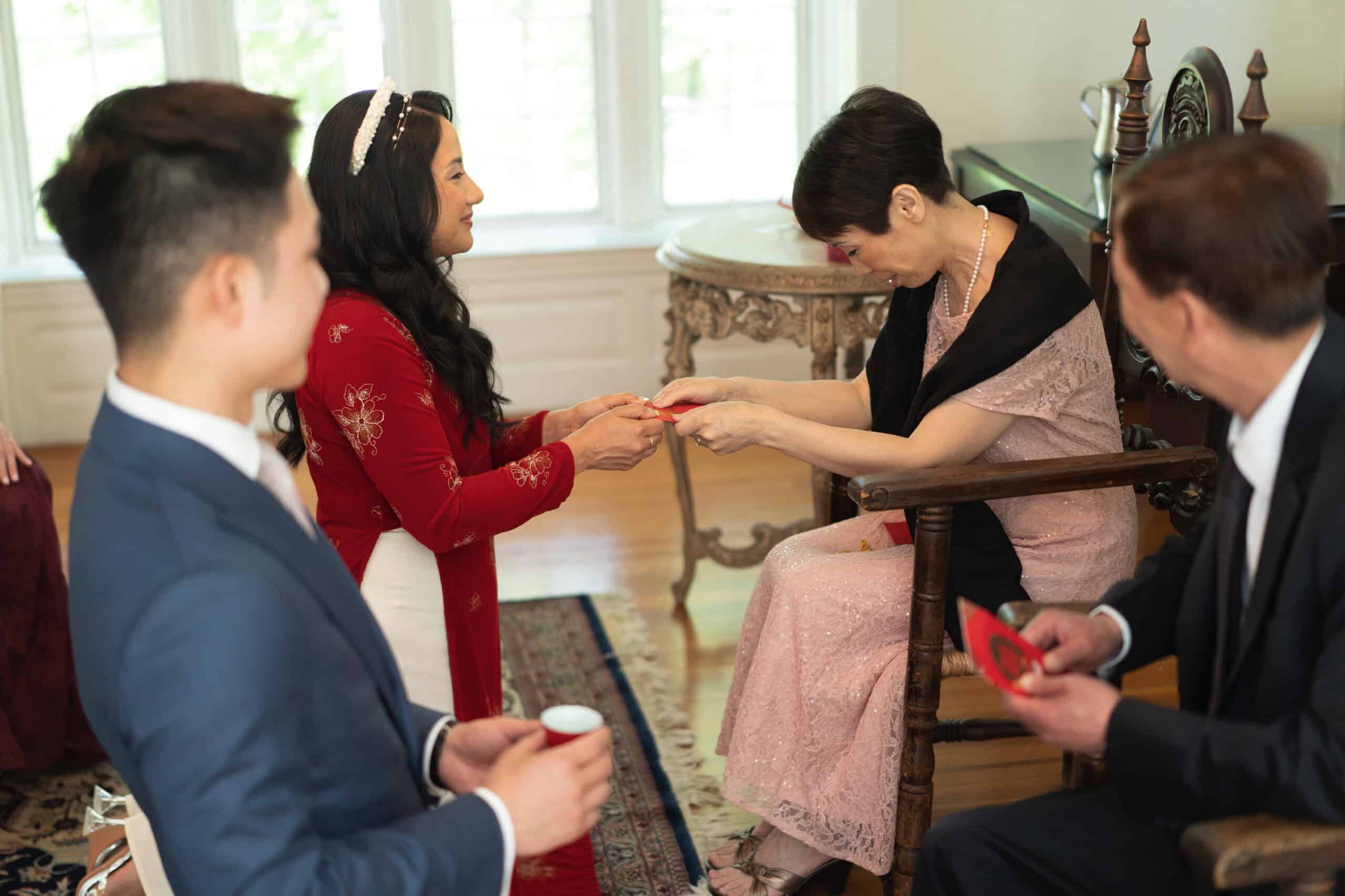 Cultural exchange ceremony with traditional attire and respectful exchange of gifts.