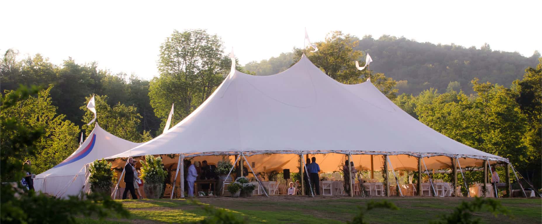 Outdoor event tent for weddings and parties with elegant decor.