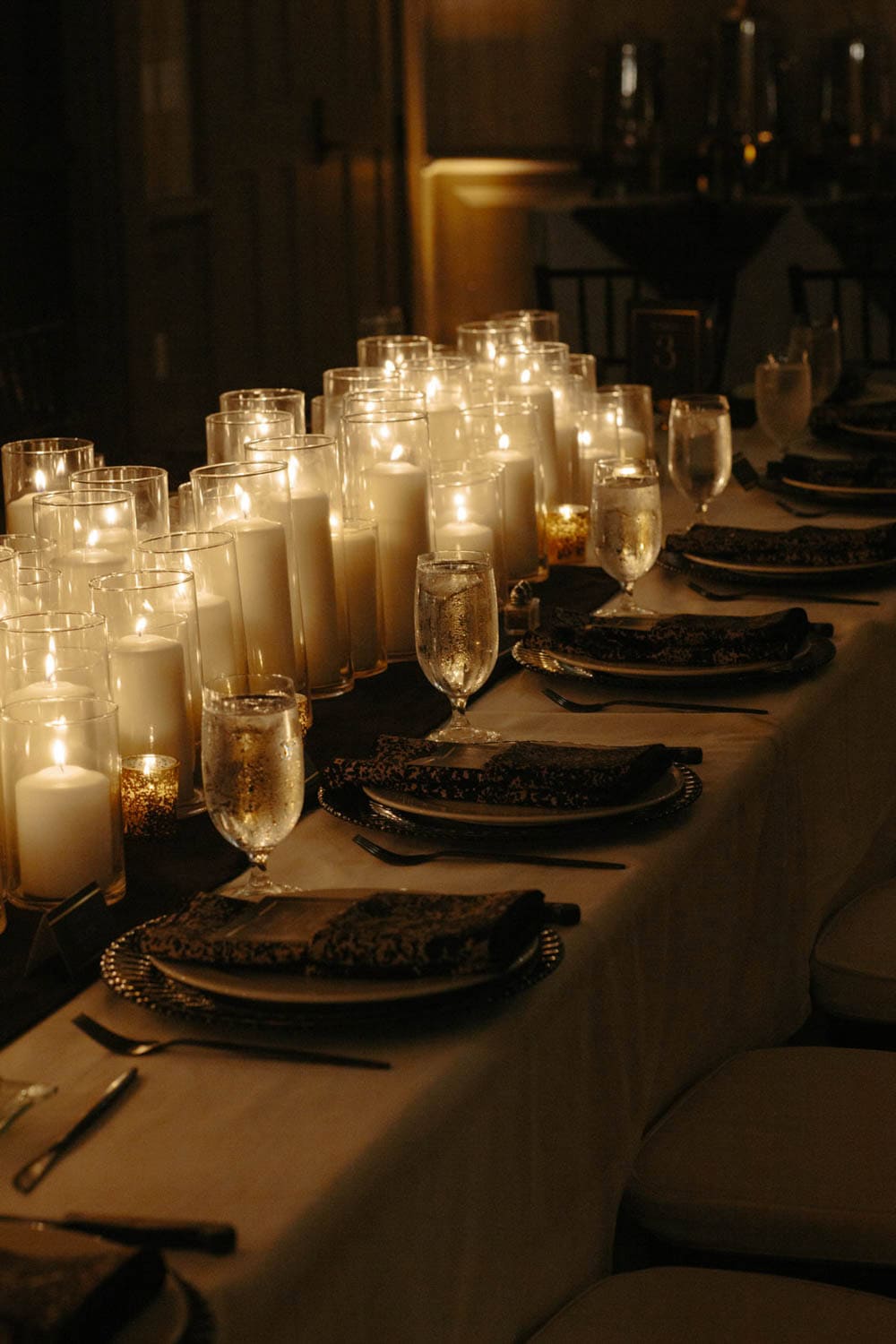 Elegant candlelit dinner table setup for a special event or celebration.