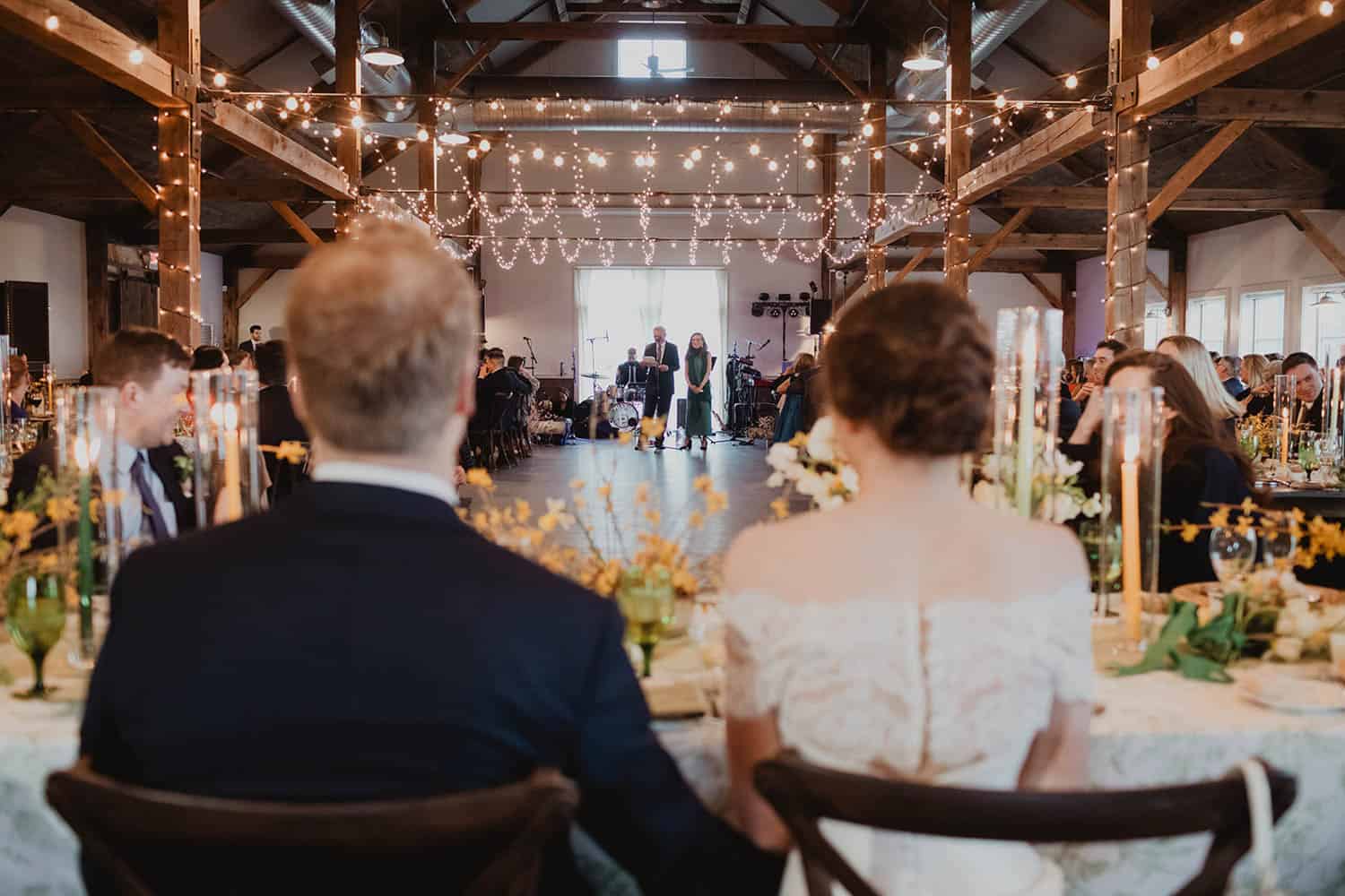 Wedding reception with elegant decor and string lights at Odyssey Events venue.