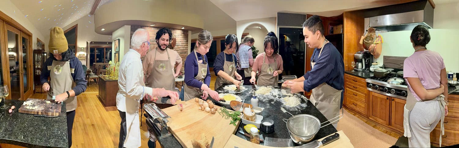 People participating in a cooking class at Odyssey Events kitchen.