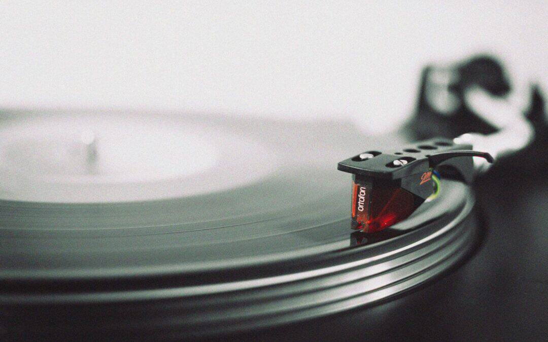 Turntable playing vinyl record at Odyssey Events, wedding entertainment setup.